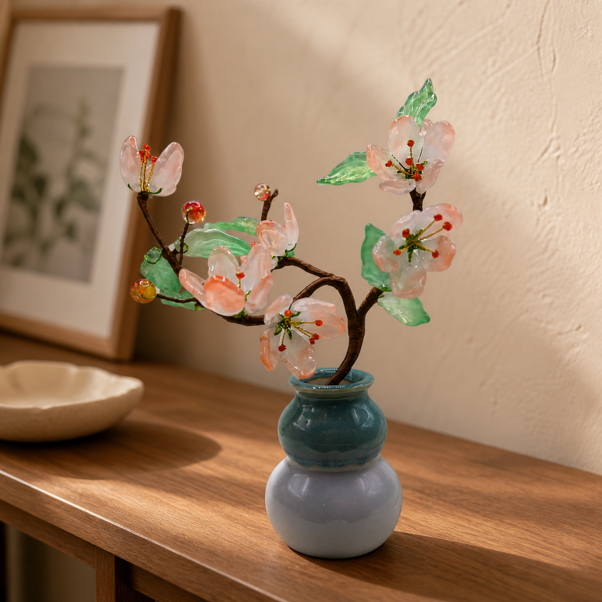Blush glass peach blossom tree displayed in an entryway