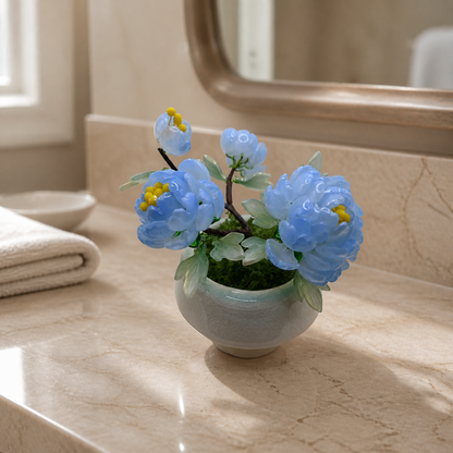 Sky blue glass peony arrangement in a bathroom setting
