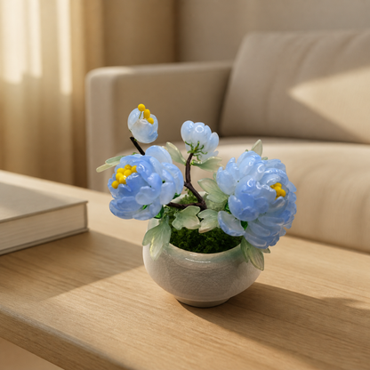 Sky blue glass peony arrangement on a coffee table