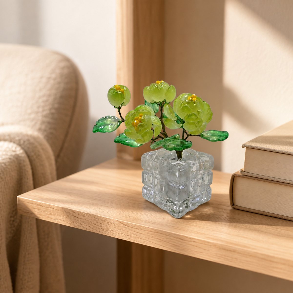 Spring green glass peony arrangement on a reading shelf
