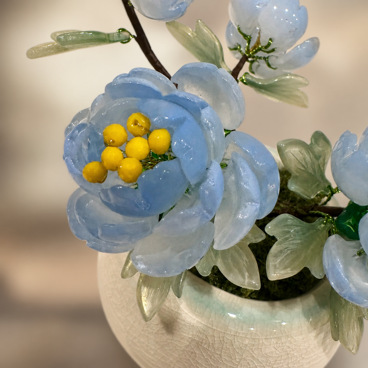 Close-up of sky blue glass peony petals and leaves