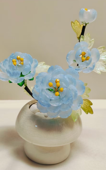 Handmade sky blue glass peony arrangement in a ceramic vase