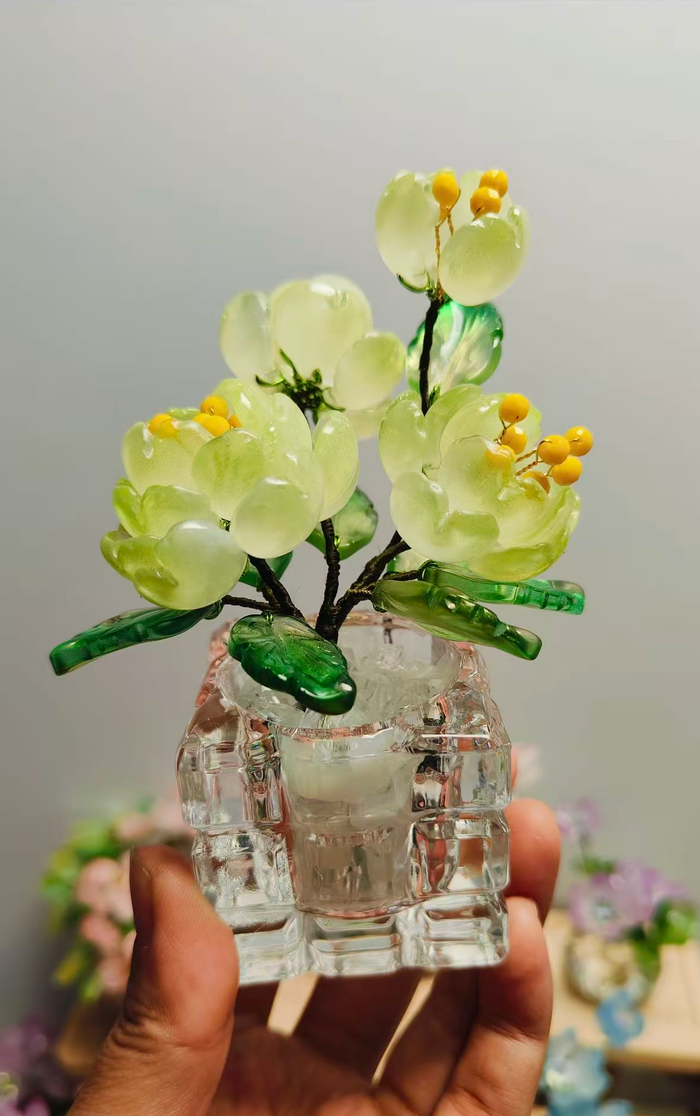 Handmade spring green glass peony arrangement in a clear glass vase